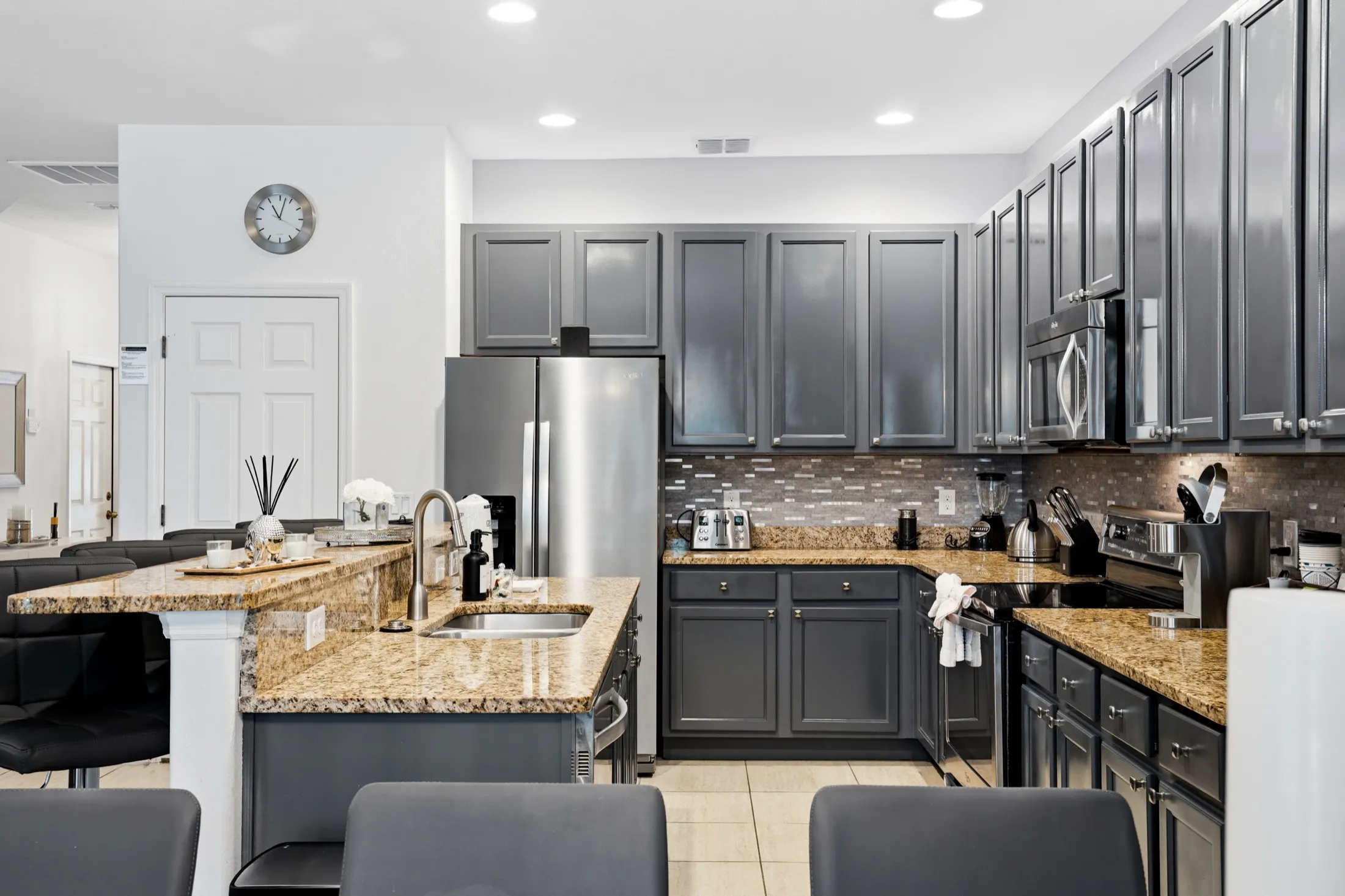 Fully equipped open-plan kitchen at The Watersong Residence villa in Davenport, Florida