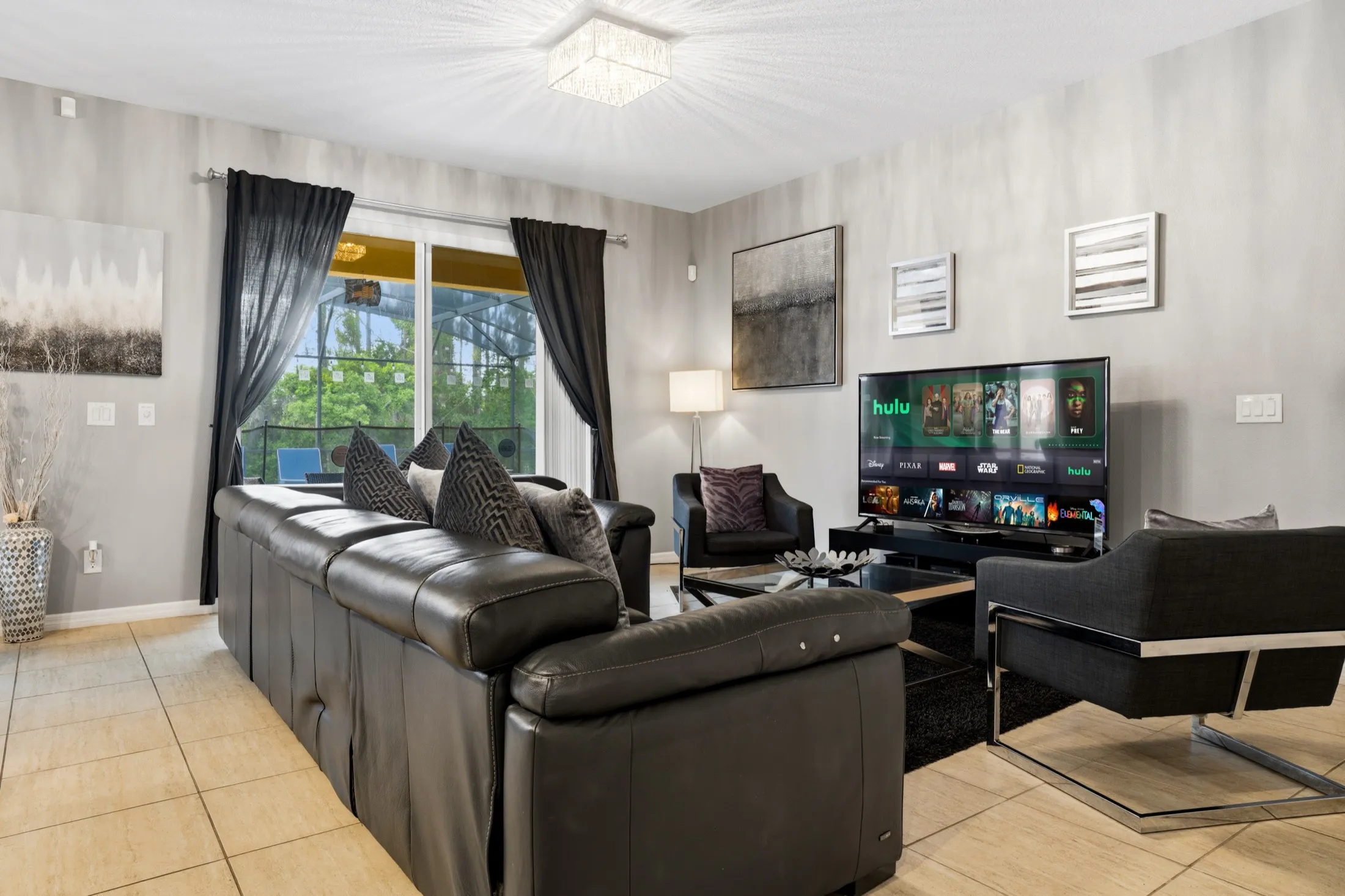 Salon with reclining leather sofa and 65-inch Smart TV